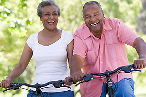 Two seniors enjoying a bike ride
